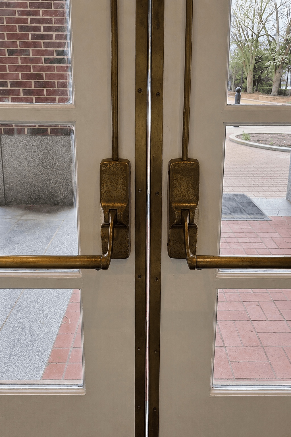 Tarnished brass door hardware before refinishing