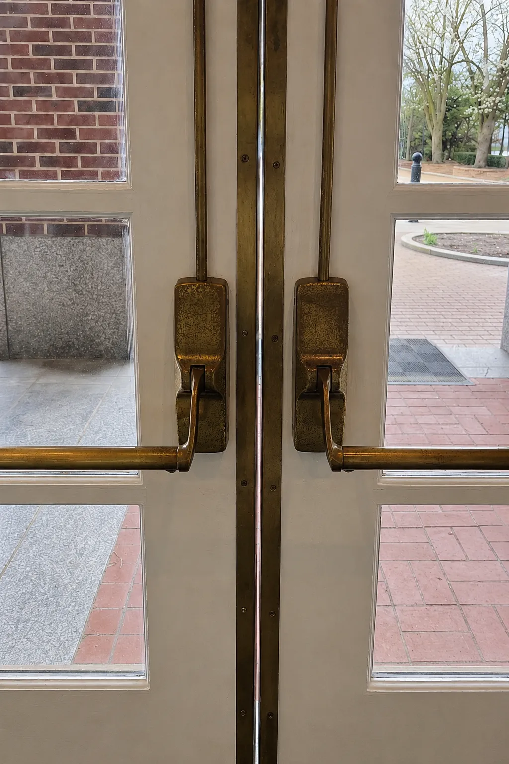 Tarnished brass door hardware before refinishing